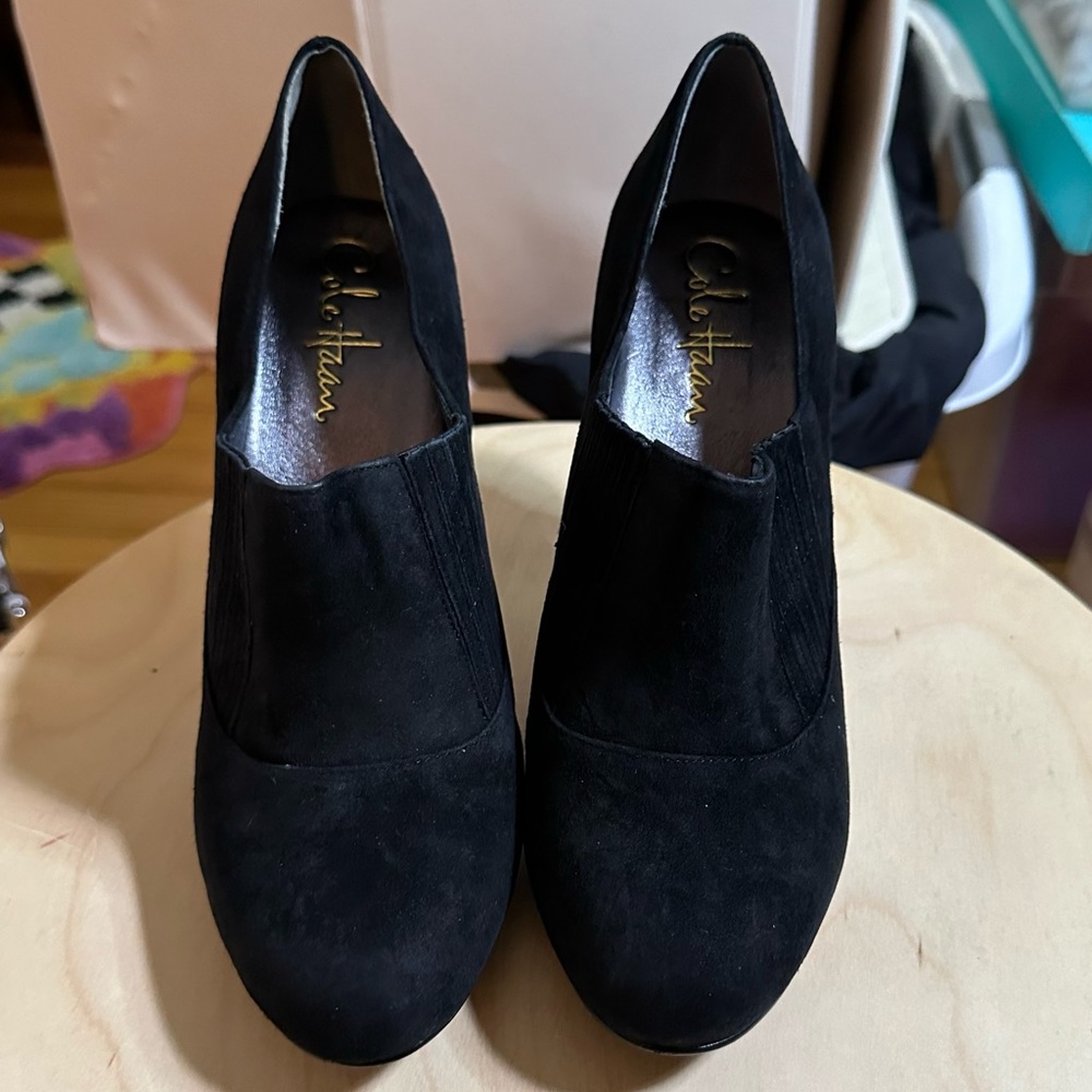 Cole Haan black suede high heeled shoe.